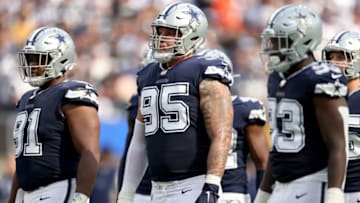 INGLEWOOD, CALIFORNIA - SEPTEMBER 19: Brent Urban #95 of the Dallas Cowboys waits on defense with Carlos Watkins #91 and Tarell Basham #93 during a 20-17 win over the Los Angeles Chargers at SoFi Stadium on September 19, 2021 in Inglewood, California. (Photo by Harry How/Getty Images)
