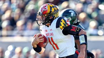 Nov 14, 2015; East Lansing, MI, USA; Maryland Terrapins quarterback Perry Hills (11) carries the ball against the Michigan State Spartans during the first half at Spartan Stadium. Mandatory Credit: Mike Carter-USA TODAY Sports