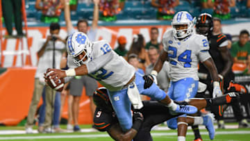 MIAMI, FL - SEPTEMBER 27: Chazz Surratt #12 of the North Carolina Tar Heels scores a touchdown in the first quarter against the Miami Hurricanes at Hard Rock Stadium on September 27, 2018 in Miami, Florida. (Photo by Mark Brown/Getty Images)