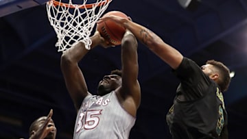 LAWRENCE, KANSAS - NOVEMBER 12: Udoka Azubuike #35 of the Kansas Jayhawks shoots as Ra Kpedi #15 and Anthony Lamb #3 of the Vermont Catamounts defend during the game at Allen Fieldhouse on November 12, 2018 in Lawrence, Kansas. (Photo by Jamie Squire/Getty Images)