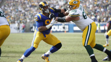 LOS ANGELES, CA - OCTOBER 28: Aaron Donald #99 of the Los Angeles Rams rushes against Lane Taylor #65 of the Green Bay Packers during the game at Los Angeles Memorial Coliseum on October 28, 2018 in Los Angeles, California. (Photo by Joe Robbins/Getty Images)