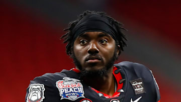 ATLANTA, GA - JANUARY 01: Richard LeCounte #2 of the Georgia Bulldogs watches on from the sidelines during the first half of the Chick-fil-A Peach Bowl against the Cincinnati Bearcats at Mercedes-Benz Stadium on January 1, 2021 in Atlanta, Georgia. (Photo by Todd Kirkland/Getty Images)
