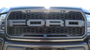 MIAMI, FL - OCTOBER 26: The front grill of a Ford F-150 pickup truck is seen on Metro Ford's sales lot on October 26, 2017 in Miami, Florida. Ford reported it's quarterly earnings per share of 39 cents, above Wall Street expectations of 33 cents driven in part by strong sales of its F-Series pickup trucks. (Photo by Joe Raedle/Getty Images)