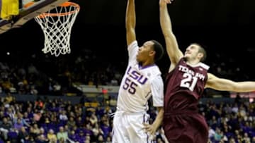 Jan 17, 2015; Baton Rouge, LA, USA; LSU Tigers guard Tim Quarterman (55) is fouled by Texas A&M Aggies guard Alex Caruso (21) while attempting to dunk during the second half of a game at the Pete Maravich Assembly Center. Texas A&M defeated LSU 67-64. Mandatory Credit: Derick E. Hingle-USA TODAY Sports