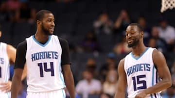 Oct 20, 2016; Charlotte, NC, USA; Charlotte Hornets forward Michael Kidd-Gilchrist (14) talks with guard Kemba Walker (15) during the second half of the game against the Miami Heat at the Spectrum Center. Hornets win 96-88. Mandatory Credit: Sam Sharpe-USA TODAY Sports
