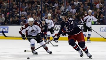 Apr 1, 2014; Columbus, OH, USA; Columbus Blue Jackets center Ryan Johansen (19) gains control of the puck as Colorado Avalanche defenseman Tyson Barrie (4) trails the play during the third period at Nationwide Arena. Colorado defeated Columbus 3-2. Mandatory Credit: Russell LaBounty-USA TODAY Sports