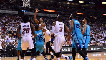 Apr 17, 2016; Miami, FL, USA; Miami Heat center Hassan Whiteside (21) is fouled by Charlotte Hornets guard Kemba Walker (15) during the second half in game one of the first round of the NBA Playoffs at American Airlines Arena. The Heat won 123-91. Mandatory Credit: Steve Mitchell-USA TODAY Sports