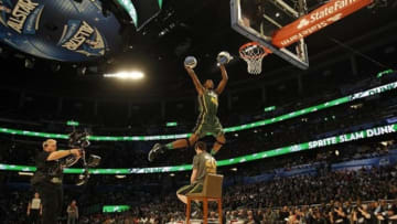 Feb 25, 2012; Orlando, FL, USA; Jeremy Evans of the Utah Jazz completes a double dunk as he jumps over teammate Gordon Hayward (20) in the 2012 NBA All-Star Slam Dunk Contest at the Amway Center. Mandatory Credit: Bob Donnan-USA TODAY Sports