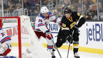 BOSTON, MA - NOVEMBER 29: New York Rangers defenseman Libor Hajek (25) battles Boston Bruins center Jack Studnicka (68) during a game between the Boston Bruins and the New York Rangers on November 29, 2019, at TD Garden in Boston, Massachusetts. (Photo by Fred Kfoury III/Icon Sportswire via Getty Images)