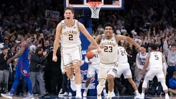 PHILADELPHIA, PA - DECEMBER 21: Collin Gillespie #2 and Jermaine Samuels #23 of the Villanova Wildcats react after defeating the Kansas Jayhawks at the Wells Fargo Center on December 21, 2019 in Philadelphia, Pennsylvania. The Villanova Wildcats defeated the Kansas Jayhawks 56-55. (Photo by Mitchell Leff/Getty Images)