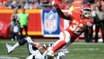 Sep 11, 2016; Kansas City, MO, USA; Kansas City Chiefs running back Spencer Ware (32) is tackled by San Diego Chargers safety Dwight Lowery (20) in the second half at Arrowhead Stadium. Kansas City won 33-27. Mandatory Credit: John Rieger-USA TODAY Sports