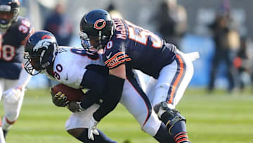 Nov 22, 2015; Chicago, IL, USA; Denver Broncos tight end Vernon Davis (80) is tackled by Chicago Bears inside linebacker Shea McClellin (50) during the first half at Soldier Field. Mandatory Credit: Dennis Wierzbicki-USA TODAY Sports