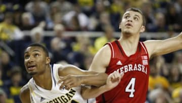 Feb 5, 2014; Ann Arbor, MI, USA; Michigan Wolverines guard Zak Irvin (21) and Nebraska Cornhuskers guard Nathan Hawkins (4) fight for position during the second half at Crisler Arena. Wolverines beat the Cornhuskers 79-50. Mandatory Credit: Raj Mehta-USA TODAY Sports