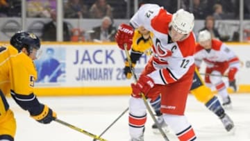 Jan 6, 2015; Nashville, TN, USA; Carolina Hurricanes center Eric Staal (12) shoots the puck into the zone during the second period against the Nashville Predators at Bridgestone Arena. Mandatory Credit: Christopher Hanewinckel-USA TODAY Sports