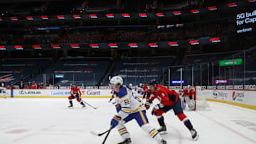 Feb 18, 2021; Washington, District of Columbia, USA; Buffalo Sabres left wing Victor Olofsson (68) skates with the puck as Washington Capitals defenseman Dmitry Orlov (9) defends in the third period at Capital One Arena. Mandatory Credit: Geoff Burke-USA TODAY Sports