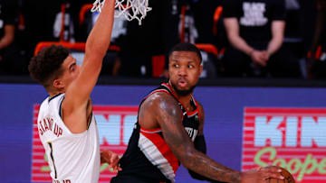 LAKE BUENA VISTA, FLORIDA - AUGUST 06: Damian Lillard #0 of the Portland Trail Blazers drives the ball to the basket against Michael Porter Jr. #1 of the Denver Nuggets at Visa Athletic Center at ESPN Wide World Of Sports Complex on August 06, 2020 in Lake Buena Vista, Florida. NOTE TO USER: User expressly acknowledges and agrees that, by downloading and or using this photograph, User is consenting to the terms and conditions of the Getty Images License Agreement. (Photo by Kevin C. Cox/Getty Images)