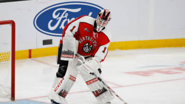 BOSTON, MA - FEBRUARY 13: Devon Levi #1 of the Northeastern Huskies tends goal during a game against the Harvard Crimson during NCAA hockey in the championship game of the annual Beanpot Hockey Tournament at TD Garden on February 13, 2023 in Boston, Massachusetts. The game officially ended in a 2-2 tie with the Huskies winning the shootout 1-0 to capture the title. (Photo by Richard T Gagnon/Getty Images)