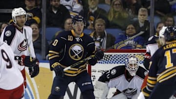 Apr 8, 2016; Buffalo, NY, USA; Buffalo Sabres left wing Cole Schneider (10) looks for a pass as Columbus Blue Jackets goalie Joonas Korpisalo (70) protects the net during the third period at First Niagara Center. Blue Jackets beat the Sabres 4-1. Mandatory Credit: Kevin Hoffman-USA TODAY Sports