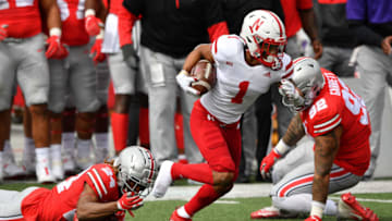 COLUMBUS, OH - OCTOBER 24: Wan'Dale Robinson #1 of the Nebraska Cornhuskers breaks free from a tackle by Shaun Wade #24 of the Ohio State Buckeyes in the second quarter and loses his shoe at Ohio Stadium on October 24, 2020 in Columbus, Ohio. (Photo by Jamie Sabau/Getty Images)