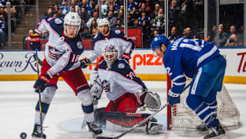 TORONTO, ON - FEBRUARY 14: Patrick Marleau #12 of the Toronto Maple Leafs goes to the net against Joonas Korpisalo #70, Pierre-Luc Dubois #18, and Seth Jones #3 of the Columbus Blue Jackets during the third period at the Air Canada Centre on February 14, 2018 in Toronto, Ontario, Canada. (Photo by Mark Blinch/NHLI via Getty Images)
