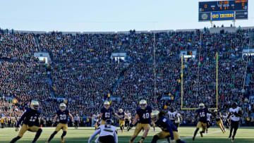 SOUTH BEND, IN - NOVEMBER 14: Tabari Hines #6 of the Wake Forest Demon Deacons lets a punt bounce as the Notre Dame Fighting Irish close in for the tackle during the first quarter at Notre Dame Stadium on November 14, 2015 in South Bend, Indiana. The Notre Dame Fighting Irish won 28-7. (Photo by Jon Durr/Getty Images)