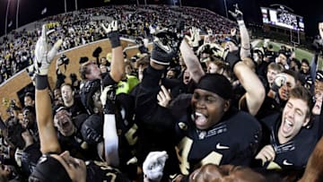 WINSTON SALEM, NC - NOVEMBER 18: The Wake Forest Demon Deacons celebrate an upset victory over the North Carolina State Wolfpack following the football game at BB&T Field on November 18, 2017 in Winston Salem, North Carolina. (Photo by Mike Comer/Getty Images)