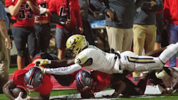 Greenville's Laquan Robinson (3) shoves a falling Pike Road's Quinshon Judkins (4) across the sideline during a tackle in the first quarter on October 22, 2021.1022 Pike Road Vs Greenville