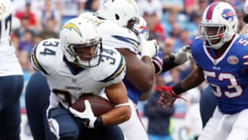 Sep 21, 2014; Orchard Park, NY, USA; San Diego Chargers running back Donald Brown (34) runs the ball during the first quarter against the Buffalo Bills at Ralph Wilson Stadium. Mandatory Credit: Timothy T. Ludwig-USA TODAY Sports