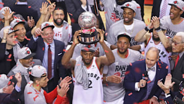 TORONTO, ON - MAY 25: Kawhi Leonard #2 of the Toronto Raptors hoists the Eastern Conference Championship trophy after defeating the Milwaukee Bucks in Game Six of the NBA Eastern Conference Final at Scotiabank Arena on May 25, 2019 in Toronto, Ontario, Canada. The Raptors defeated the Bucks 100-94 to win the Eastern Conference Championship 4 games to 2. NOTE TO USER: user expressly acknowledges and agrees by downloading and/or using this Photograph, user is consenting to the terms and conditions of the Getty Images Licence Agreement. (Photo by Claus Andersen/Getty Images)
