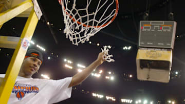 NEW ORLEANS - APRIL 7: Carmelo Anthony #15 of Syracuse cuts down the net after he and his team defeated Kansas 81-78 during the championship game of the NCAA Men's Final Four Tournament on April 7, 2003 at the Louisiana Superdome in New Orleans, Louisiana. Anthony was named the tournaments most outstanding player. (Photo by Craig Jones/Getty Images)