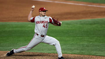 ARLINGTON, TEXAS - FEBRUARY 22: Kevin Kopps #45 of the Arkansas Razorbacks throws against the TCU Horned Frogs in the eighth inning during the 2021 State Farm College Baseball Showdown at Globe Life Field on February 22, 2021 in Arlington, Texas. (Photo by Ronald Martinez/Getty Images)