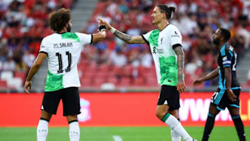SINGAPORE, SINGAPORE - JULY 30: Darwin Nunez #9 (C) of Liverpool celebrates with Mohamed Salah #11 (L) after scoring their team's first goal past Ricardo Pereira #21 of Leicester City during the first half of the pre-season friendly at the National Stadium on July 30, 2023 in Singapore. (Photo by Yong Teck Lim/Getty Images)