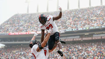 AUSTIN, TX - NOVEMBER 29: SaRodorick Thompson #28 of the Texas Tech Red Raiders is lifted in celebration by teammates after a touchdown in the first quarter against the Texas Longhorns at Darrell K Royal-Texas Memorial Stadium on November 29, 2019 in Austin, Texas. (Photo by Tim Warner/Getty Images)