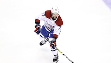 TORONTO, ONTARIO - AUGUST 14: Brett Kulak #77 of the Montreal Canadiens skates with the puck against the Philadelphia Flyers during the third period in Game Two of the Eastern Conference First Round during the 2020 NHL Stanley Cup Playoffs at Scotiabank Arena on August 14, 2020 in Toronto, Ontario, Canada. (Photo by Elsa/Getty Images)