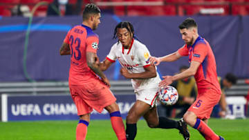 SEVILLE, SPAIN - DECEMBER 02: Jules Kounde of Sevilla FC competes for the ball with Jorginho of Chelsea FC during the UEFA Champions League Group E stage match between FC Sevilla and Chelsea FC at Estadio Ramon Sanchez Pizjuan on December 02, 2020 in Seville, Spain. Sporting stadiums around Spain remain under strict restrictions due to the Coronavirus Pandemic as Government social distancing laws prohibit fans inside venues resulting in games being played behind closed doors. (Photo by Mateo Villalba/Quality Sport Images/Getty Images)