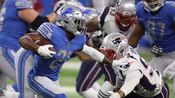 DETROIT, MI - AUGUST 25: Ameer Abdullah #21 of the Detroit Lions tries to get around the tackle of Kyle Van Noy #53 of the New England Patriots in the first quarter during a preseason game at Ford Field on August 25, 2017 in Detroit, Michigan. (Photo by Gregory Shamus/Getty Images)
