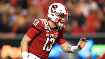 RALEIGH, NORTH CAROLINA - NOVEMBER 09: Devin Leary #13 of the North Carolina State Wolfpack calls a play against the Clemson Tigers during their game at Carter-Finley Stadium on November 09, 2019 in Raleigh, North Carolina. (Photo by Streeter Lecka/Getty Images)