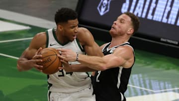 MILWAUKEE, WISCONSIN - MAY 04: Giannis Antetokounmpo #34 of the Milwaukee Bucks is fouled by Blake Griffin #2 of the Brooklyn Nets during the first half of a game at Fiserv Forum on May 04, 2021 in Milwaukee, Wisconsin. NOTE TO USER: User expressly acknowledges and agrees that, by downloading and or using this photograph, User is consenting to the terms and conditions of the Getty Images License Agreement. (Photo by Stacy Revere/Getty Images)