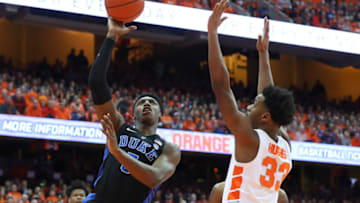 SYRACUSE, NY - FEBRUARY 23: RJ Barrett #5 of the Duke Blue Devils shoots the ball around Elijah Hughes #33 of the Syracuse Orange during the first half at the Carrier Dome on February 23, 2019 in Syracuse, New York. (Photo by Rich Barnes/Getty Images)