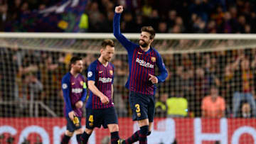 Barcelona's Spanish defender Gerard Pique celebrates with teammates after scoring during the UEFA Champions League round of 16, second leg football match between FC Barcelona and Olympique Lyonnais at the Camp Nou stadium in Barcelona on March 13, 2019. (Photo by Josep LAGO / AFP) (Photo credit should read JOSEP LAGO/AFP/Getty Images)