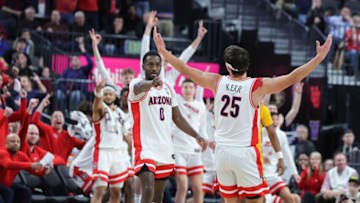 LAS VEGAS, NEVADA - MARCH 10: Courtney Ramey #0 and Kerr Kriisa #25 of the Arizona Wildcats celebrate after Kriisa hit a 3-pointer against the Arizona State Sun Devils in the second half of a semifinal game of the Pac-12 basketball tournament at T-Mobile Arena on March 10, 2023 in Las Vegas, Nevada. The Wildcats defeated the Sun Devils 78-59. (Photo by Ethan Miller/Getty Images)