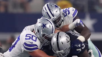 ARLINGTON, TX - AUGUST 26: Sean Lee #50 of the Dallas Cowboys and Maliek Collins #96 of the Dallas Cowboys tackle DeAndre Washington #33 of the Oakland Raiders in the first half of a preseason game at AT&T Stadium on August 26, 2017 in Arlington, Texas. (Photo by Tom Pennington/Getty Images)