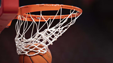 FAYETTEVILLE, AR - JANUARY 23: Basketball going through the hoop and net during warm ups before a game between the Arkansas Razorbacks and the Missouri Tigers at Bud Walton Arena on January 23, 2019 in Fayetteville, Arkansas. The Razorbacks defeated the Tigers 72-60. (Photo by Wesley Hitt/Getty Images)