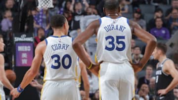 SACRAMENTO, CA - DECEMBER 14: Stephen Curry #30 and Kevin Durant #35 of the Golden State Warriors look on during the game against the Sacramento Kings on December 14, 2018 at Golden 1 Center in Sacramento, California. NOTE TO USER: User expressly acknowledges and agrees that, by downloading and or using this photograph, User is consenting to the terms and conditions of the Getty Images Agreement. Mandatory Copyright Notice: Copyright 2018 NBAE (Photo by Rocky Widner/NBAE via Getty Images)
