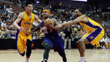 Oct 21, 2014; Anaheim, CA, USA; Phoenix Suns guard Isaiah Thomas (3) drives to the basket as Los Angeles Lakers guard Jeremy Lin (17) and Los Angeles Lakers forward Wesley Johnson (11) defend during the first half at Honda Center. Mandatory Credit: Richard Mackson-USA TODAY Sports