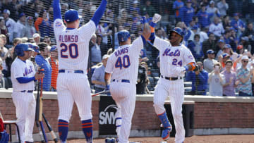 NEW YORK, NEW YORK - APRIL 06: Robinson Cano #24 of the New York Mets celebrates his eighth inning home run against the Washington Nationals with teammates Wilson Ramos #40 and Pete Alonso #20 at Citi Field on April 06, 2019 in the Flushing neighborhood of the Queens borough of New York City. (Photo by Jim McIsaac/Getty Images)