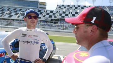 DAYTONA BEACH, FL - JUNE 30: Kyle Larson, driver of the #42 Credit One Bank Chevrolet, talks with Jamie McMurray, driver of the #1 McDonald's $1 Any Size Soft Drink Chevrolet, on the grid during qualifying for the Monster Energy NASCAR Cup Series 59th Annual Coke Zero 400 Powered By Coca-Cola at Daytona International Speedway on June 30, 2017 in Daytona Beach, Florida. (Photo by Matt Sullivan/Getty Images)