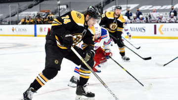 Mar 11, 2021; Boston, Massachusetts, USA; Boston Bruins left wing Jake DeBrusk (74) controls the puck during the third period against the New York Rangers at TD Garden. Mandatory Credit: Bob DeChiara-USA TODAY Sports