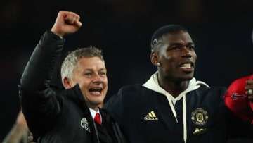 Paul Pogba and Ole Gunnar Solskjaer, Manchester United. (Photo by Matthew Ashton - AMA/Getty Images)