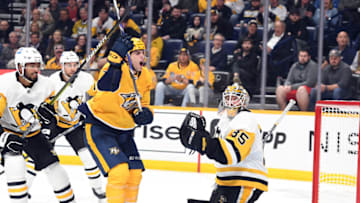 Feb 28, 2023; Nashville, Tennessee, USA; Nashville Predators right wing Luke Evangelista (77) reacts after missing wide of the net during the third period against the Pittsburgh Penguins at Bridgestone Arena. Mandatory Credit: Christopher Hanewinckel-USA TODAY Sports
